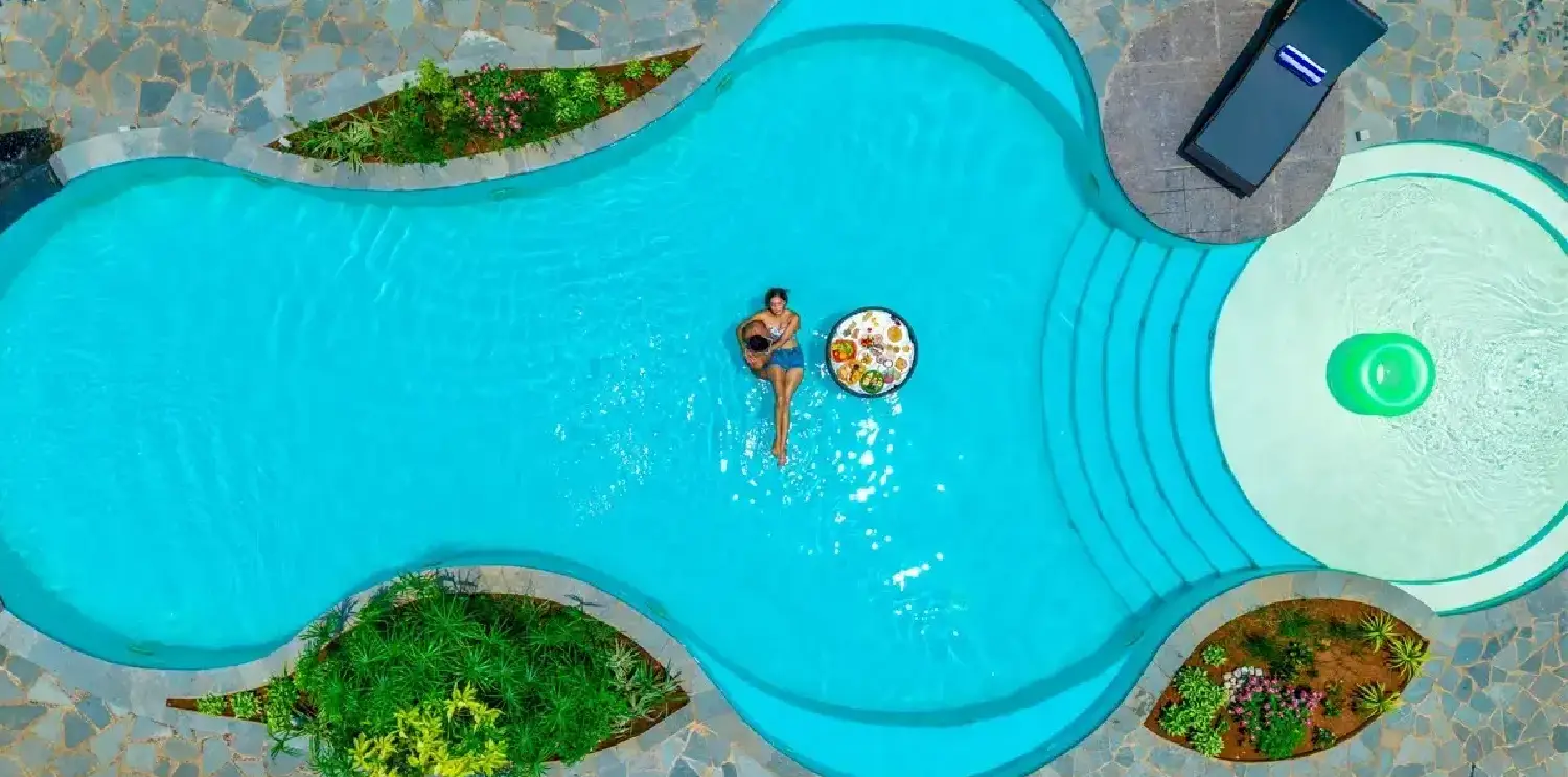 Romantic Poolside Stay at Orchid Passaros Swimming pool surrounded by resort villas for a romantic stay in South Goa